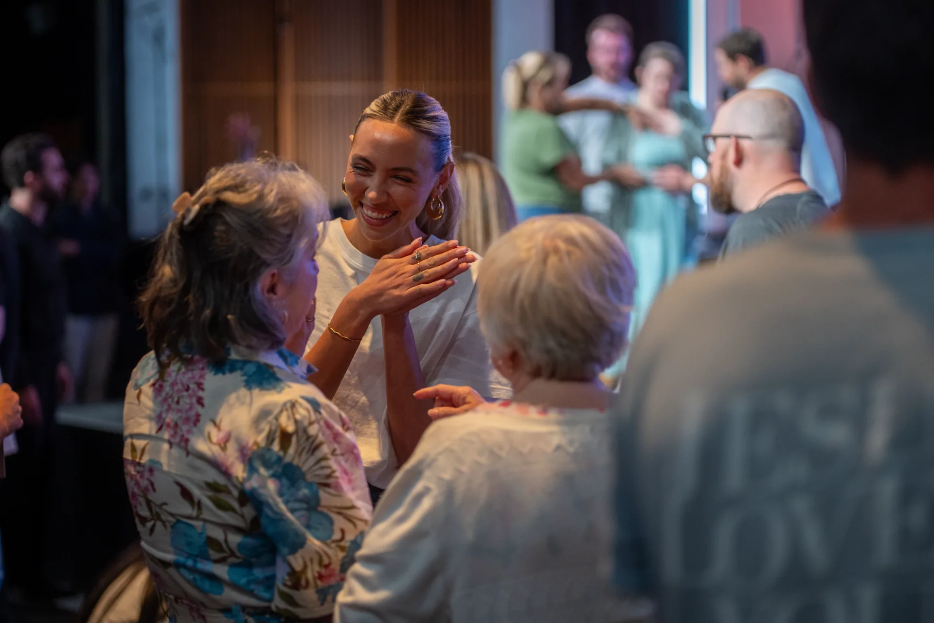 Community and prayer after service at Citipointe